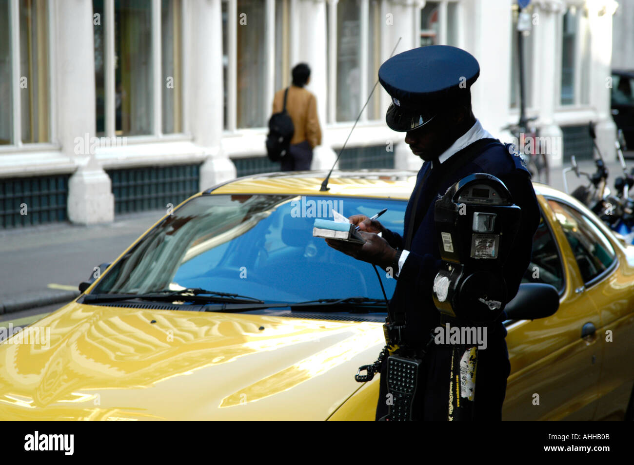 Parking attendant issuing a fine in Westminster London England UK Stock