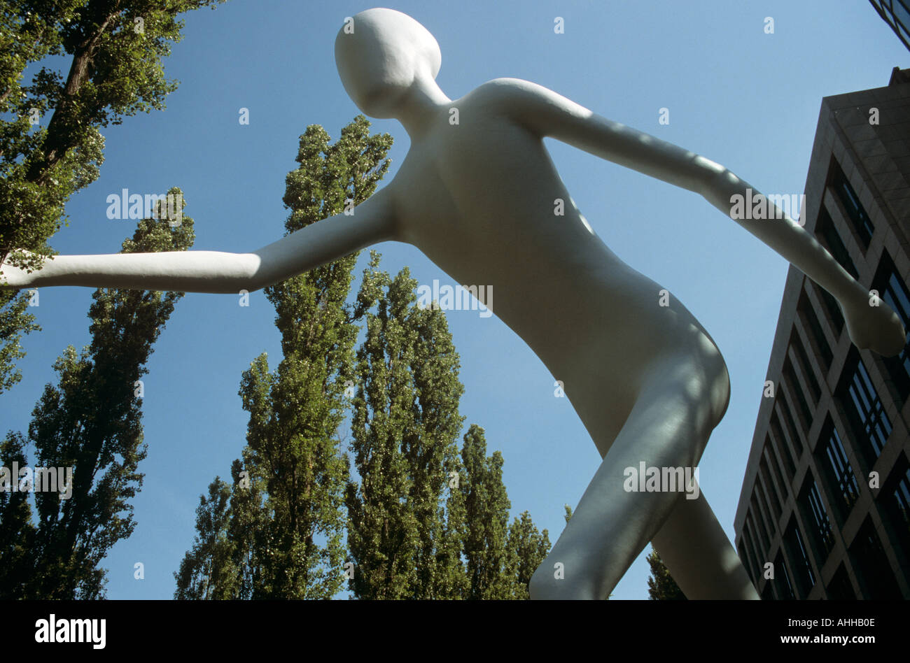 Walking man sculpture munich germany hi-res stock photography and ...