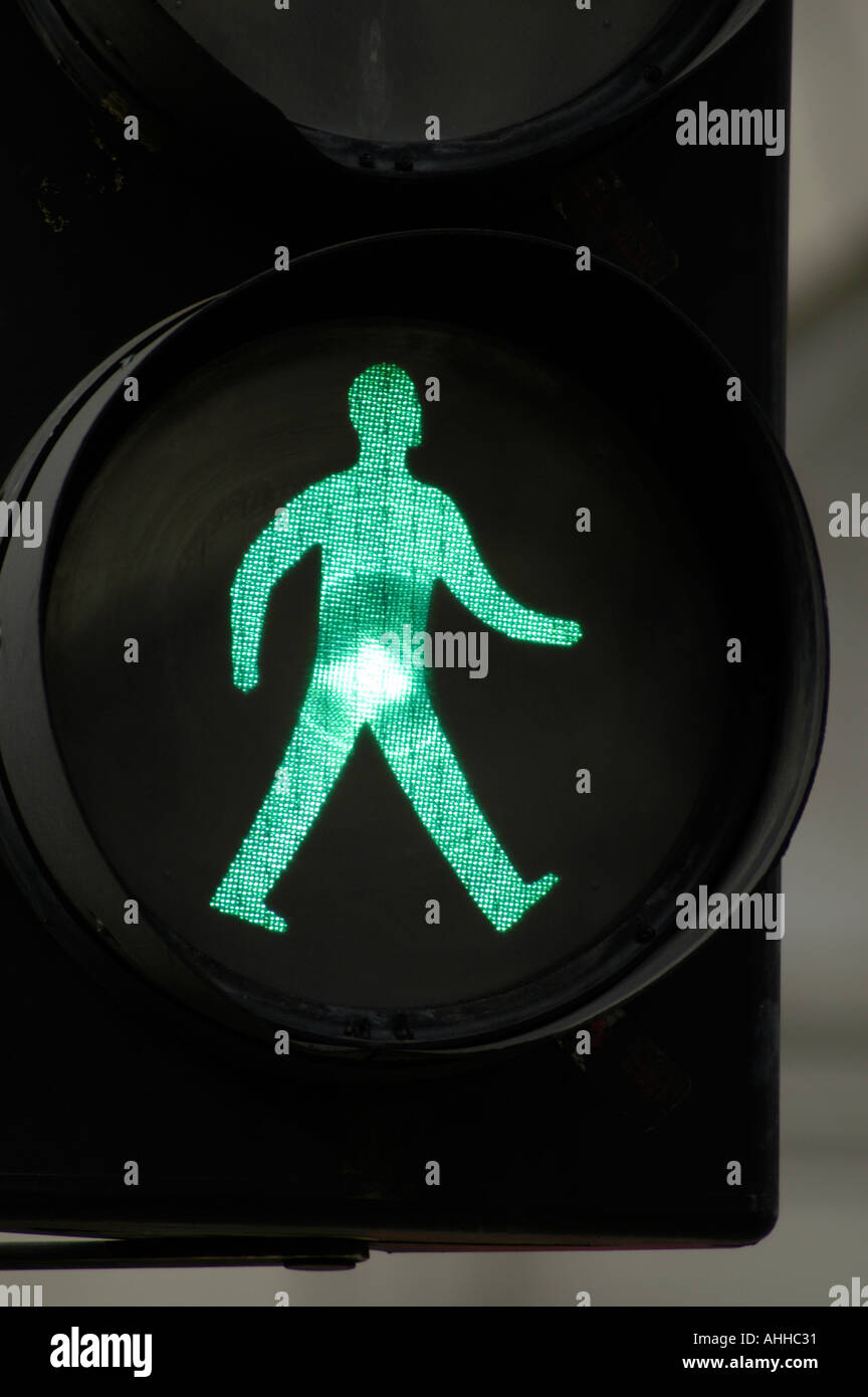 Green man go walk traffic light sign, England, UK Stock Photo