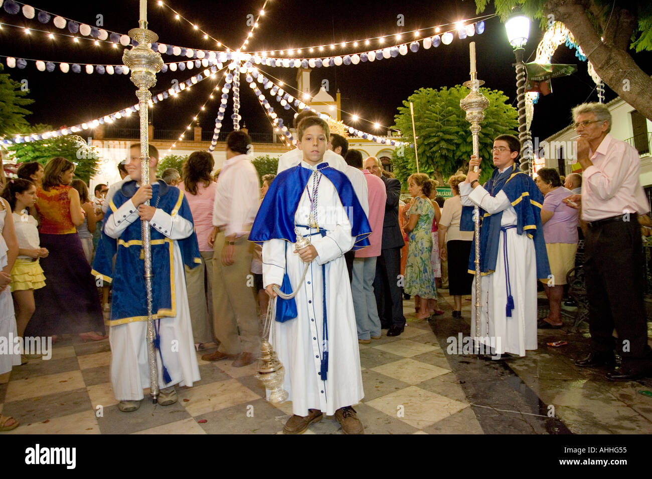 Acolytes during a night procession, Aznalcazar, Seville, Spain Stock Photo
