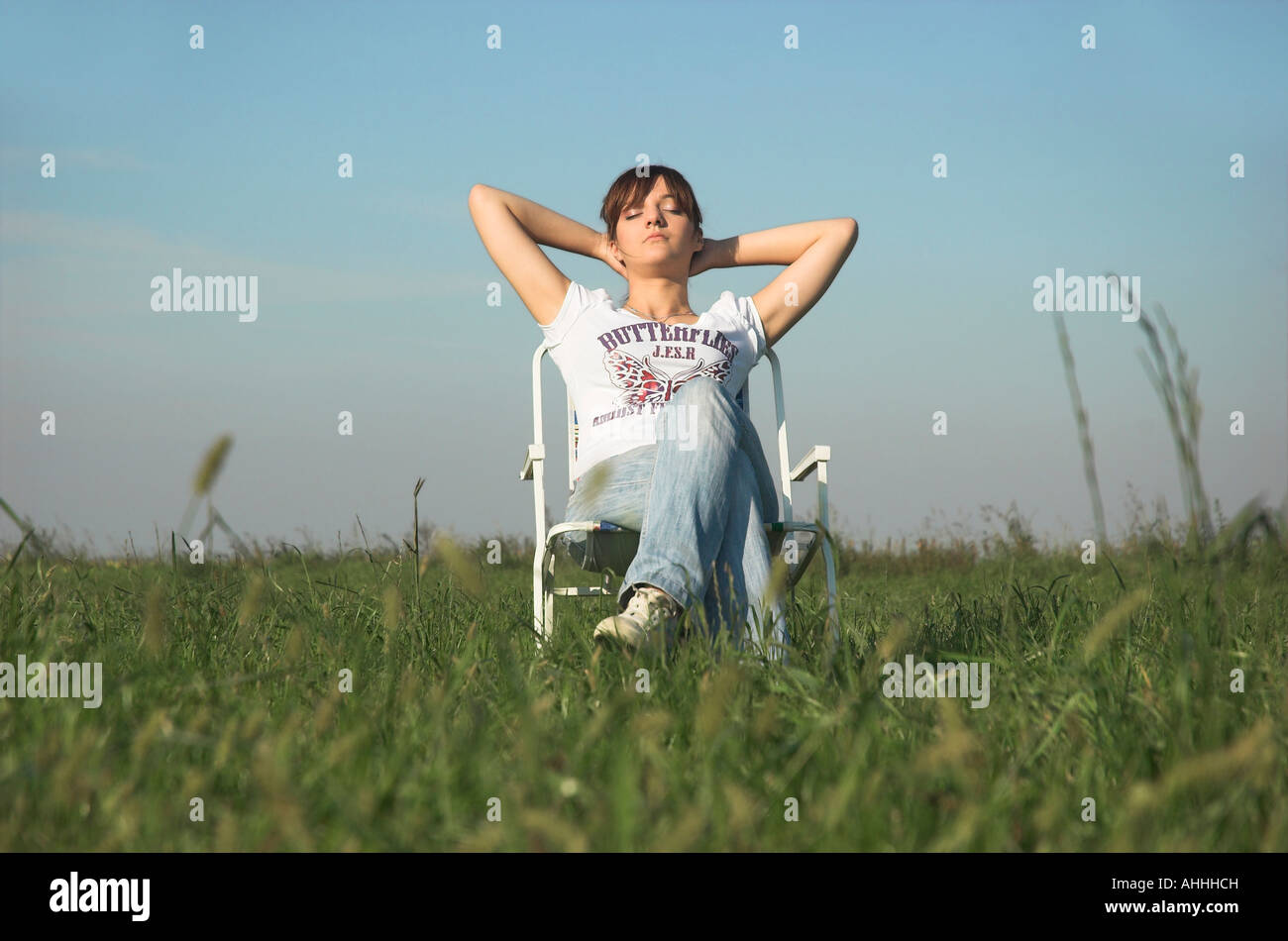 Woman sitting chair full length hi-res stock photography and images - Alamy