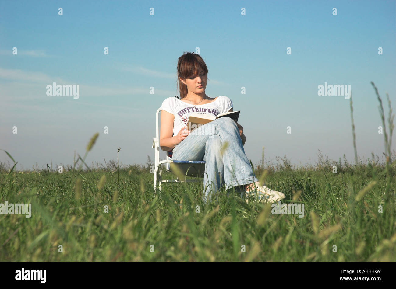 Woman sitting chair full length hi-res stock photography and images - Alamy