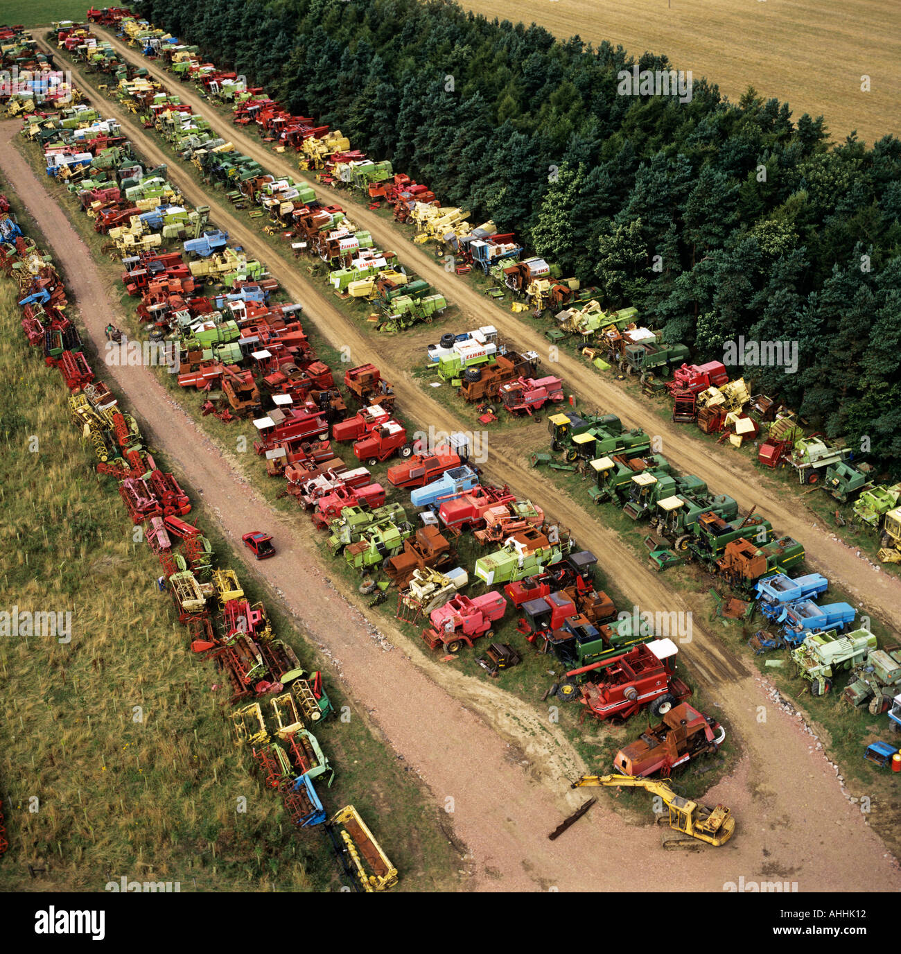 Low aerial view of combine and farm machinery scrap yard UK Stock Photo