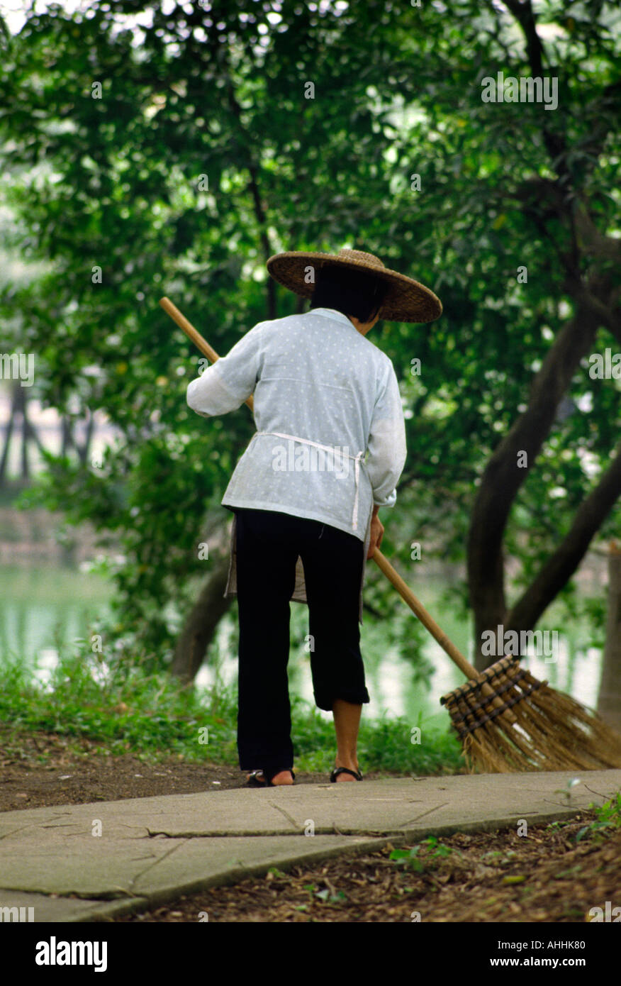 Old lady sweeping in Guanzhou China Stock Photo