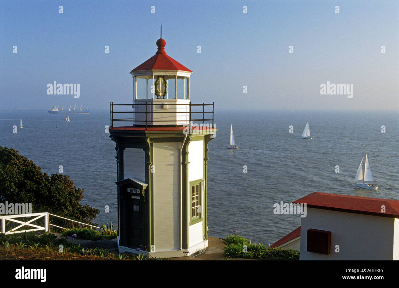 Yerba Buena Lighthouse on Yerba Buena Island with passing sailboats on San Francisco Bay Stock Photo