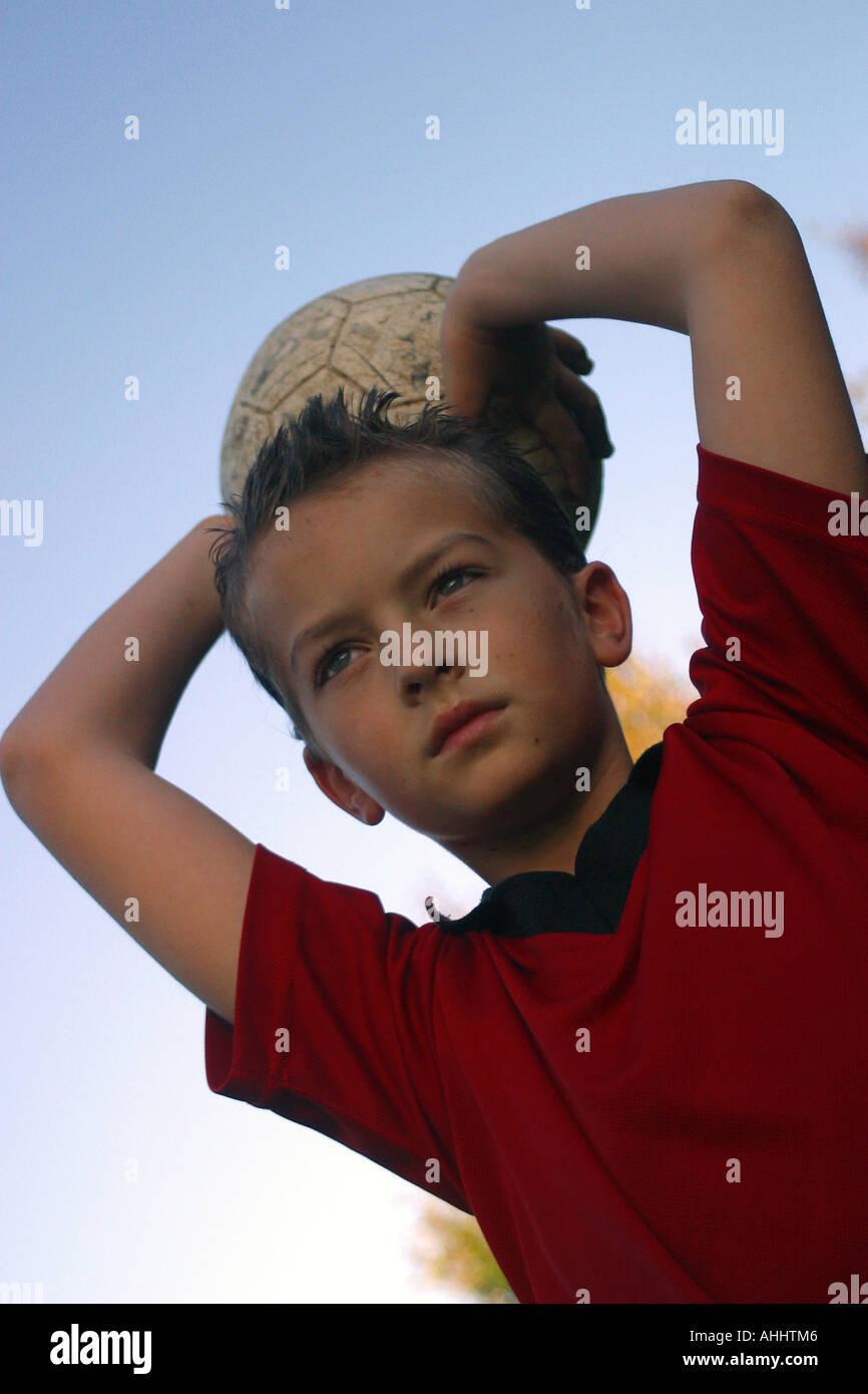Young boy throwing a soccer ball Stock Photo Alamy