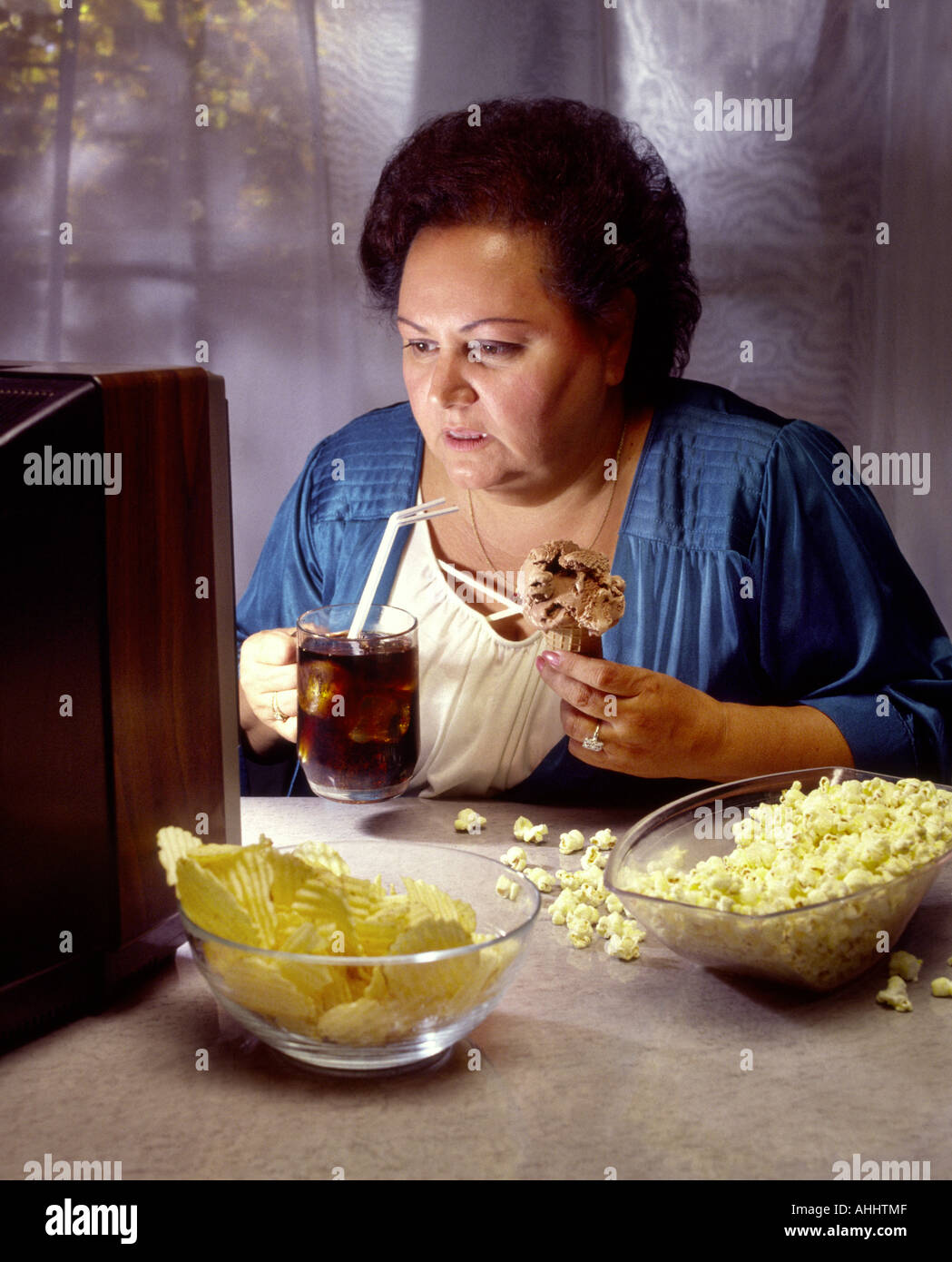 Woman eating ice cream fat hires stock photography and images Alamy