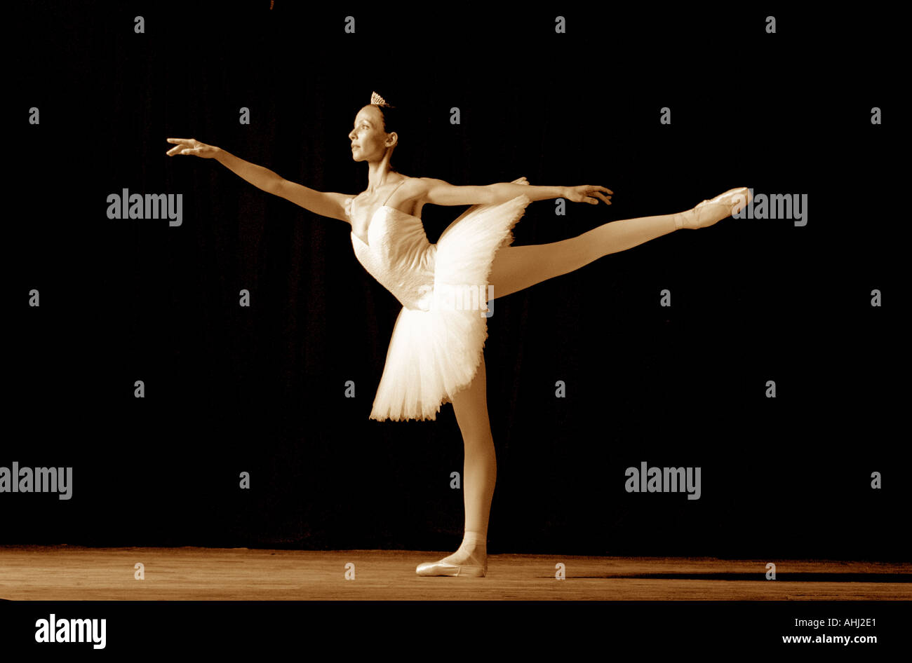 Female ballet dancer standing on her toes in toe shoes ballet dancer stage performance Stock Photo