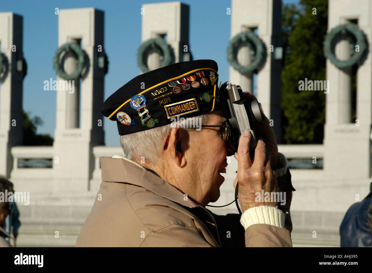 Veteran taking photograph at The World War Two Memorial on the Mall Washington DC, USA Stock Photo