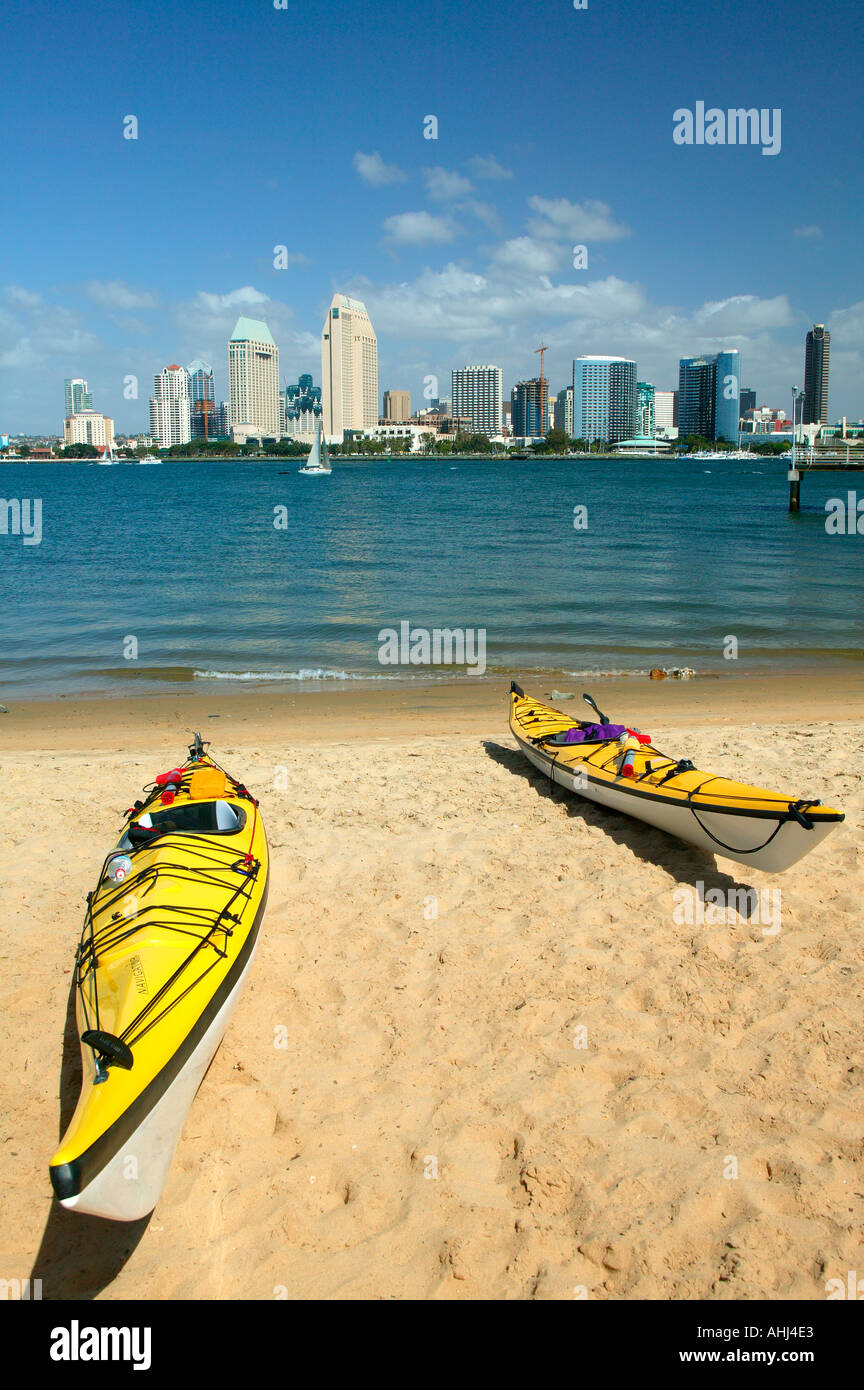 Kayaks on the beach and the downtown San Diego skyline as viewed from Coronado San Diego California Stock Photo