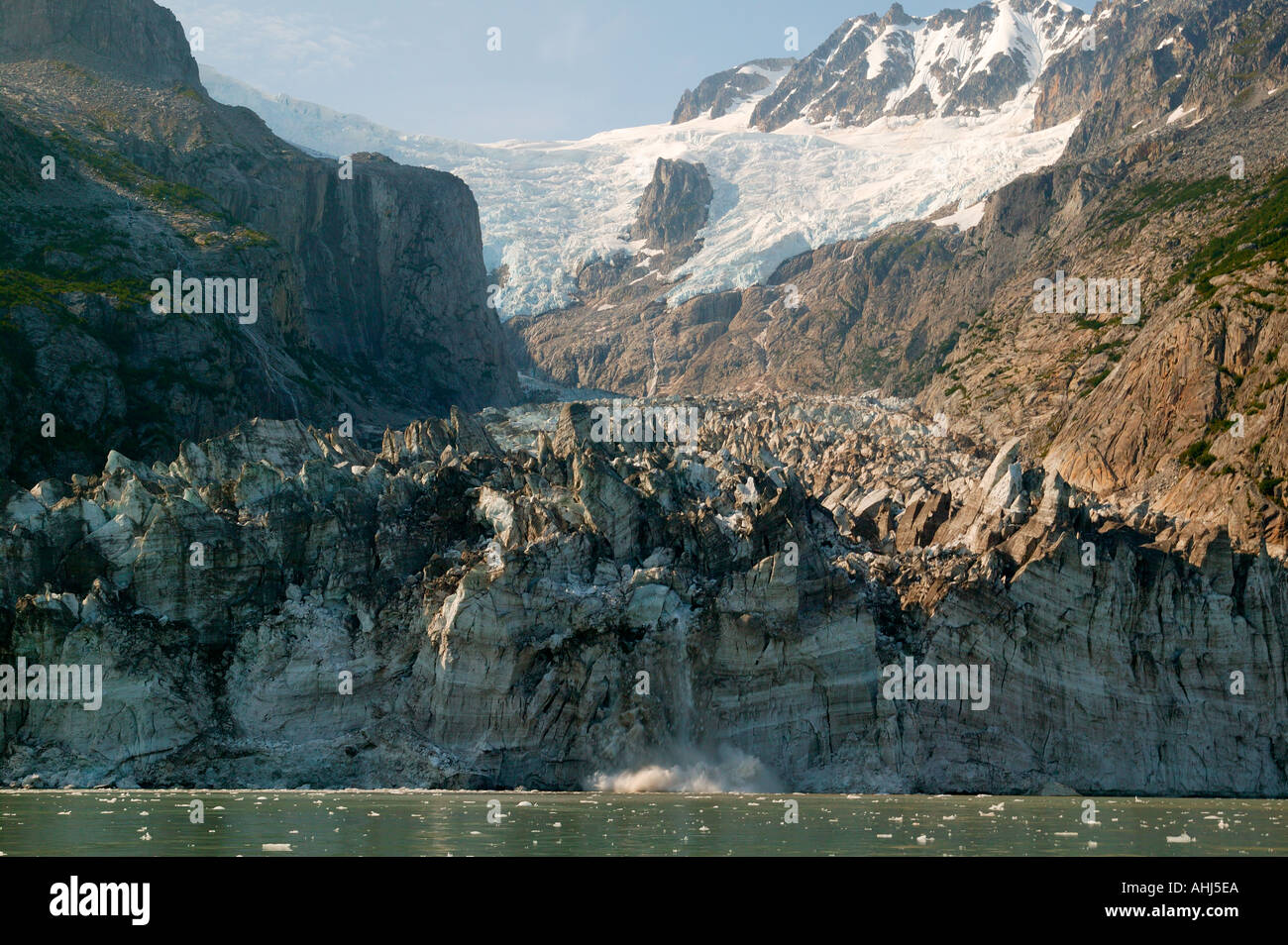 Ogive Glacier calves in Northwestern Lagoon Kenai Fjords National Park Alaska Stock Photo