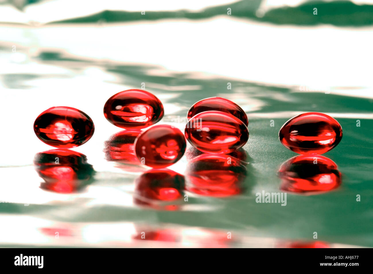 vitamin E tablets color red Stock Photo