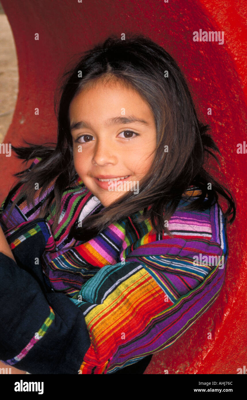 Hispanic girl in play tunnel St Paul Minnesota Stock Photo