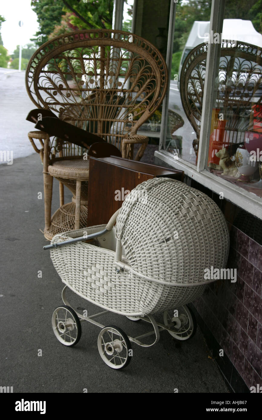 old pram and rattan chair Stock Photo