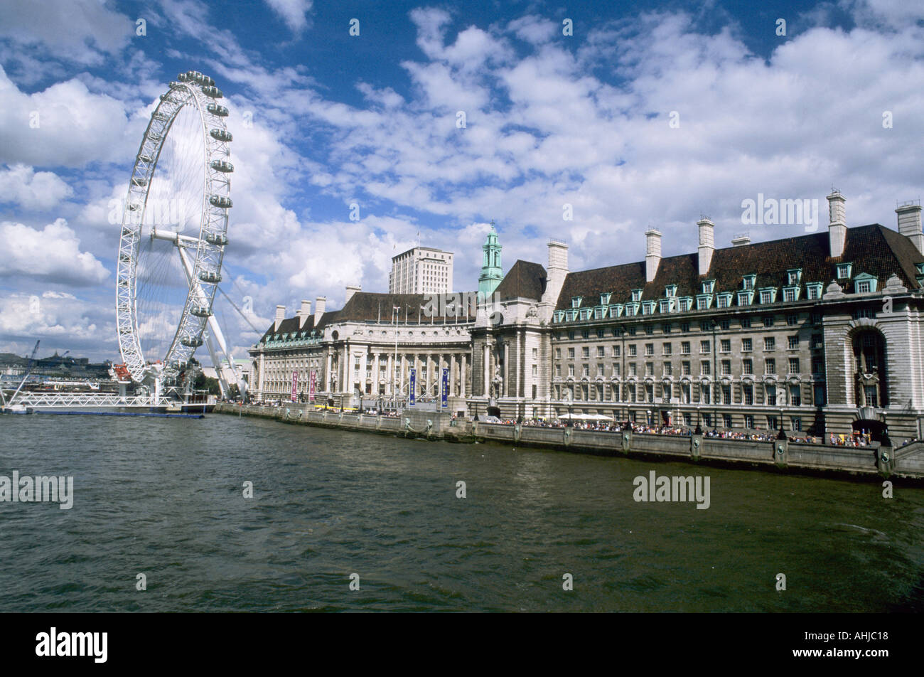 London Eye and County Hall on the South Bank with River Thames in front ...