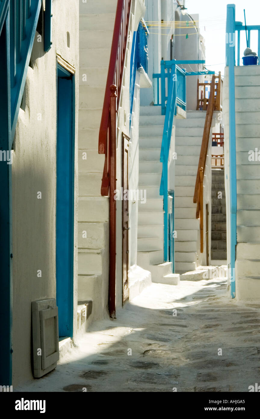 path street alley with cobblestone blue red painted railing white steps ...