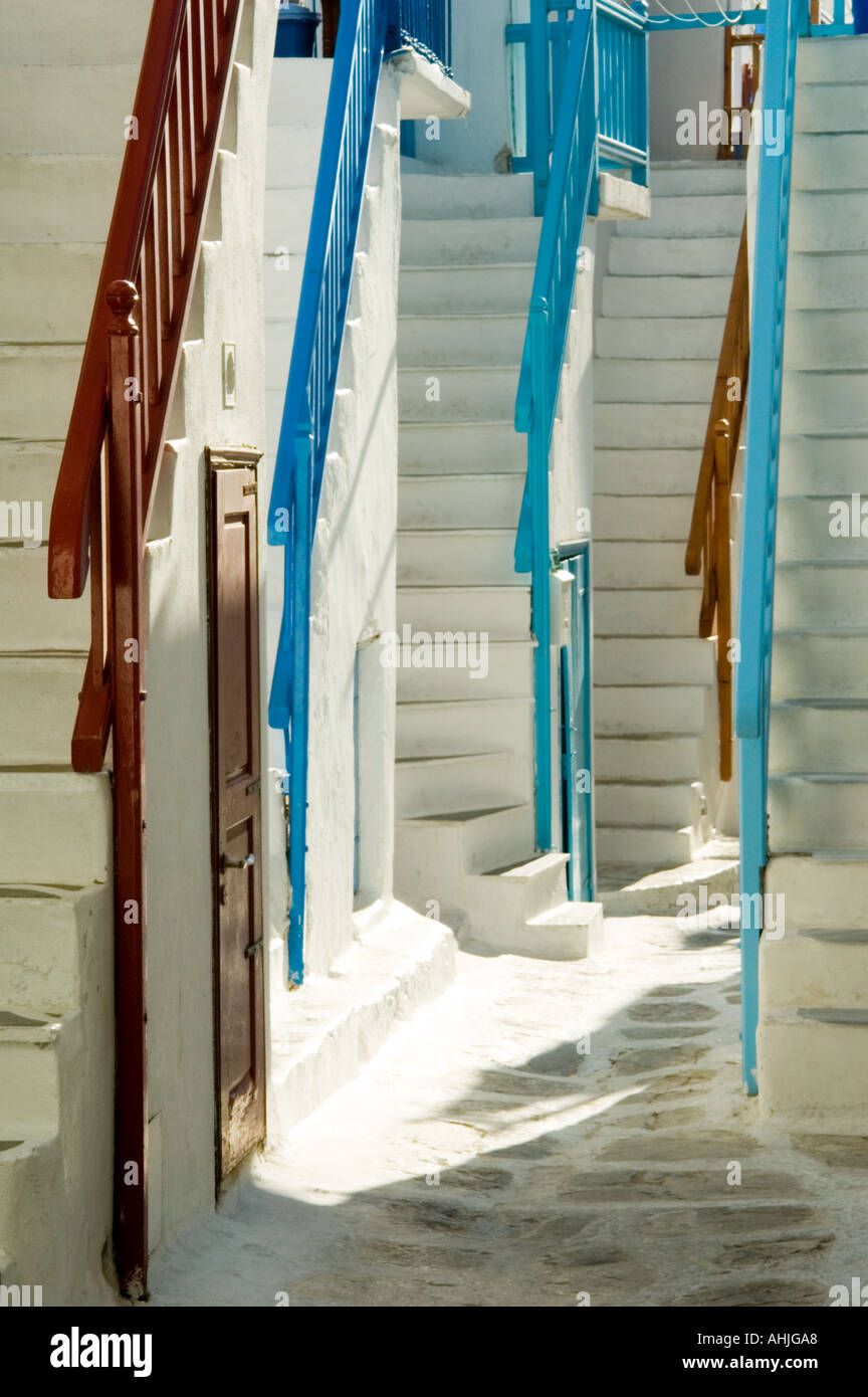 path street alley with cobblestone blue red painted railing white steps ...
