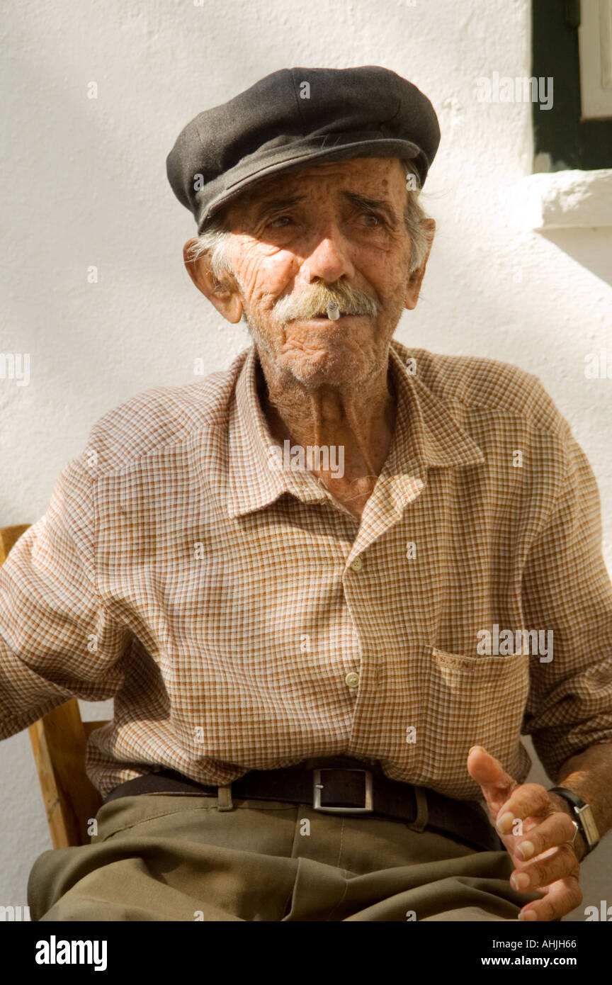 Portrait of a local elderly man in hat 