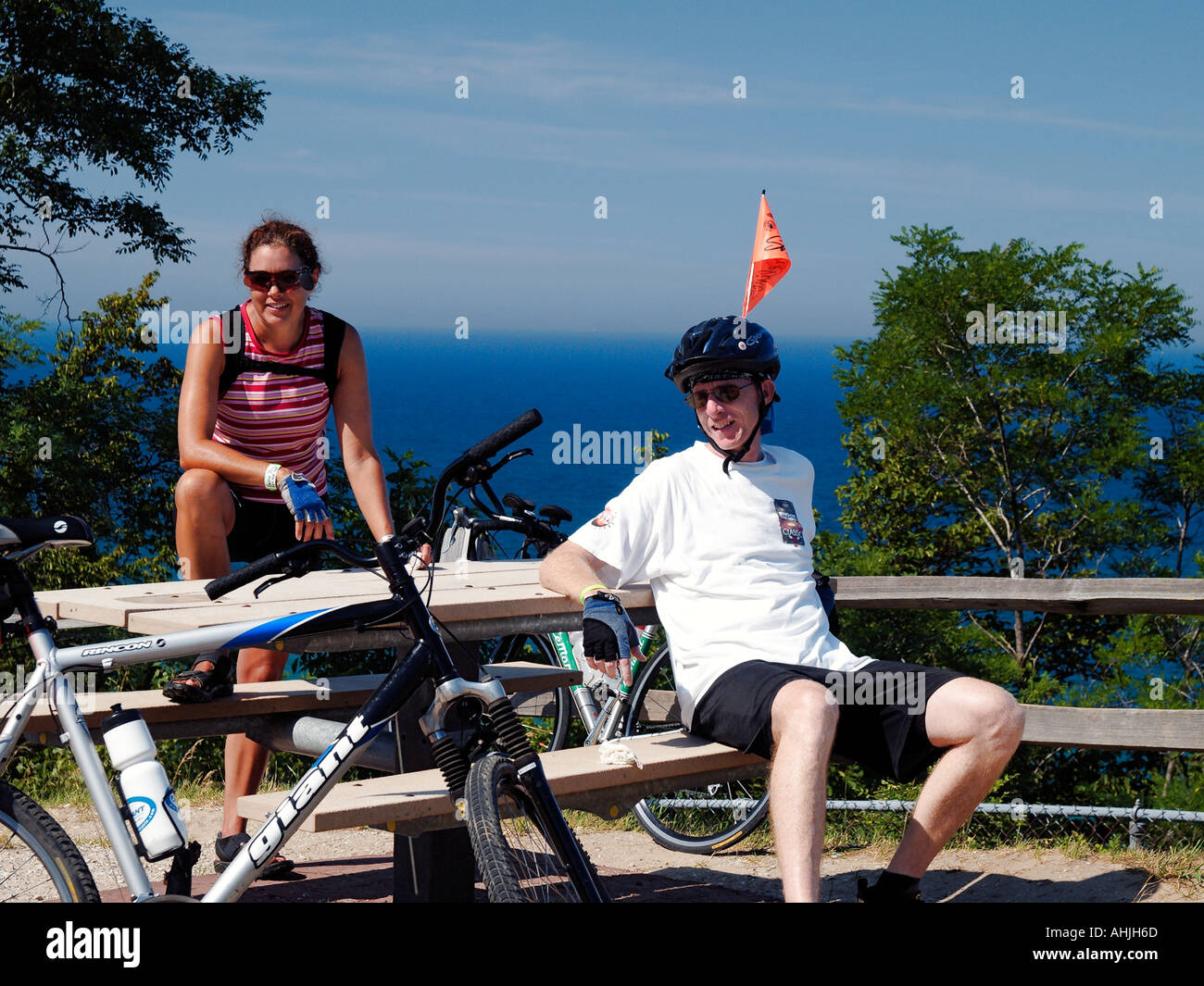 Man and woman rest atop the killer hill 1300 in 1 2 mile during the