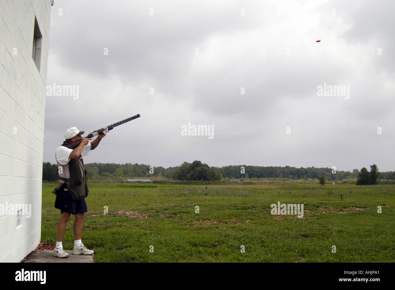 P26 129 Shooting Range, Skeet, Trap Shooter Fires At Clay Target In Air MR Stock Photo