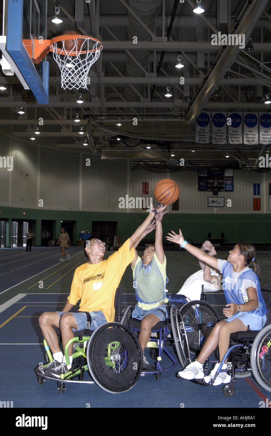 Action at Wheelchair Basketball game, features 4 male and female