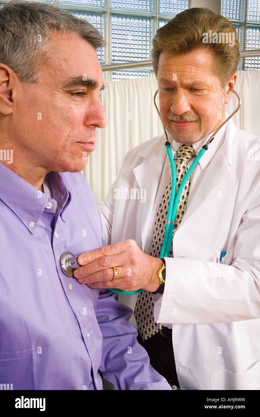 Doctor Examining Male Patient With Stethoscope Stock Photo Alamy
