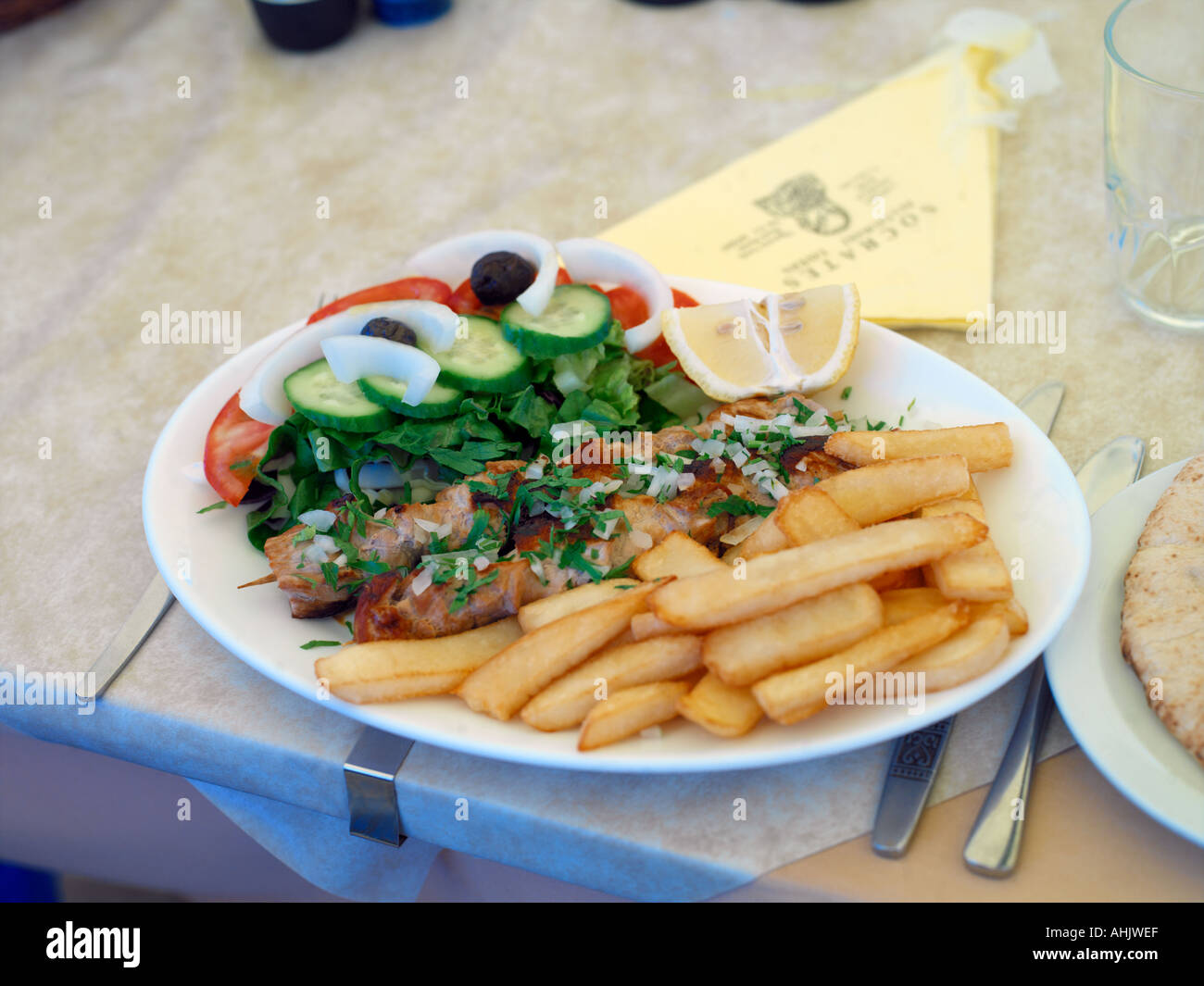 Larnaka Cyprus Kebabs with Greek Salad Chips Stock Photo Alamy