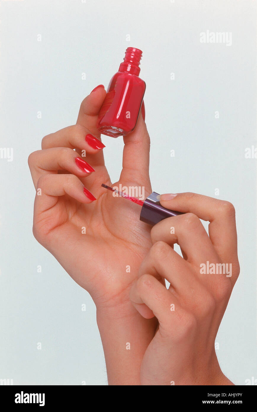 woman applying nail polish Stock Photo Alamy