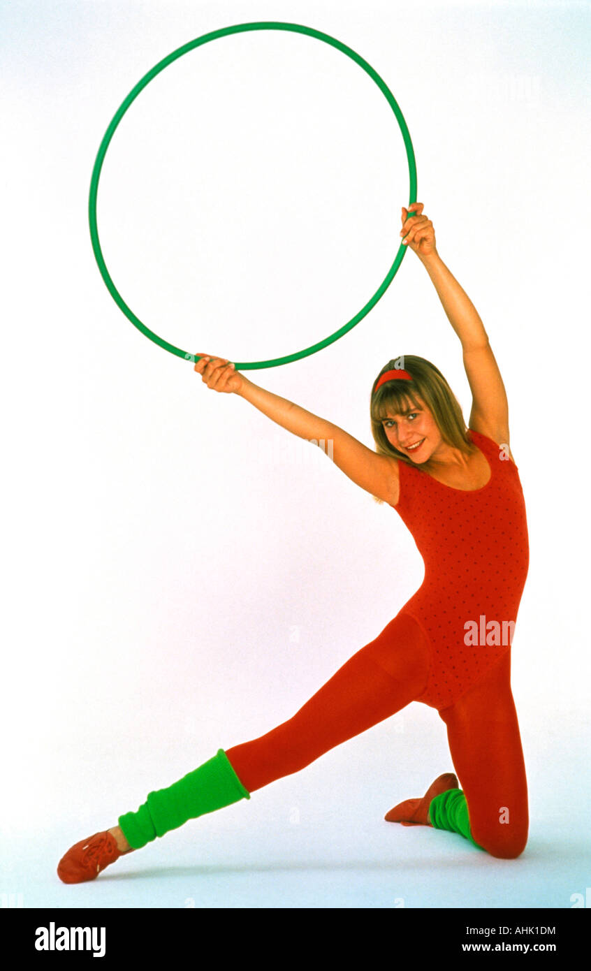 portrait of young woman with hula hoop exercising Stock Photo