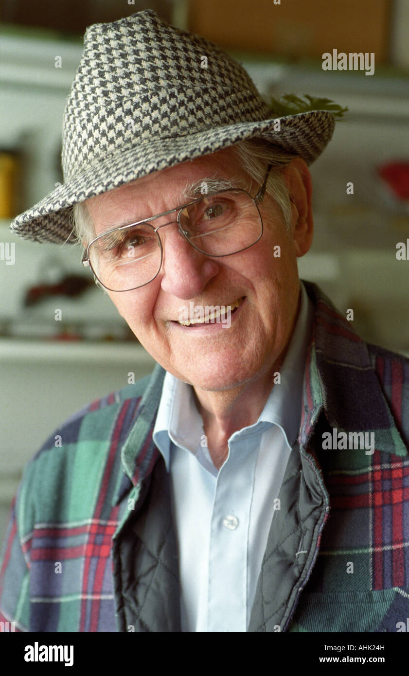 Portrait of an old man in hat smiling Stock Photo