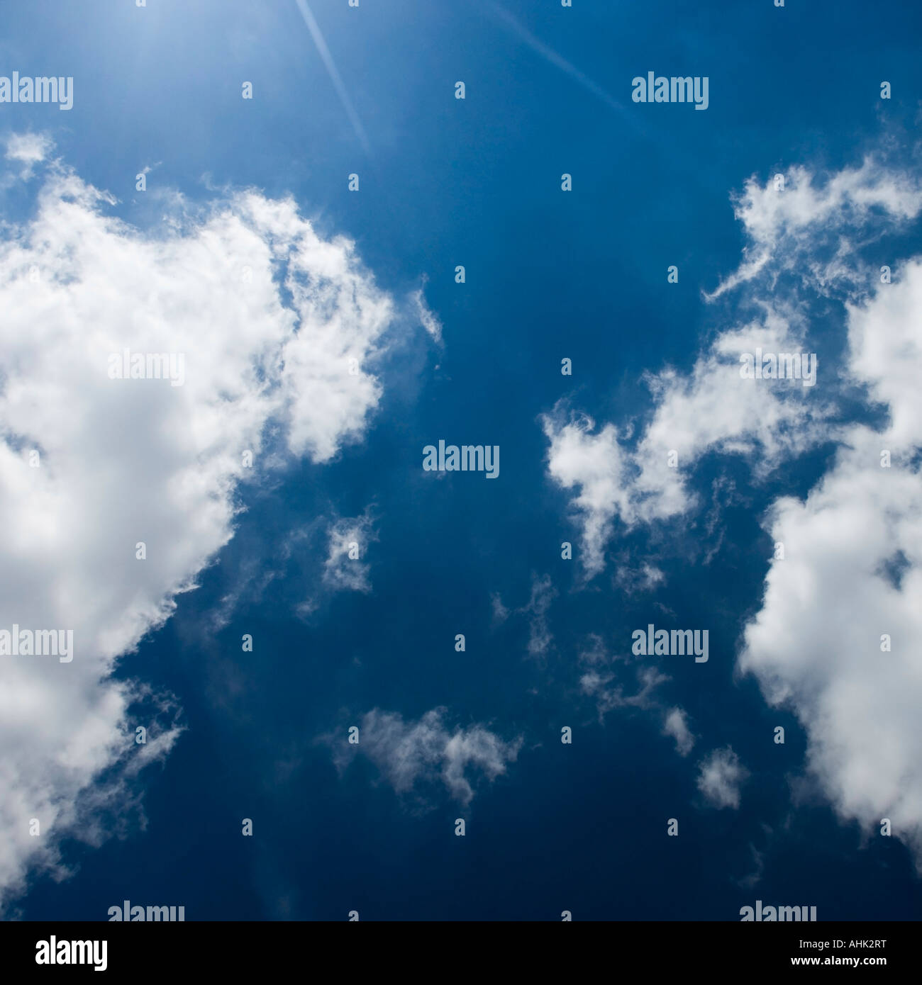 Puffy white clouds in the blue sky Surrey England UK Stock Photo Alamy