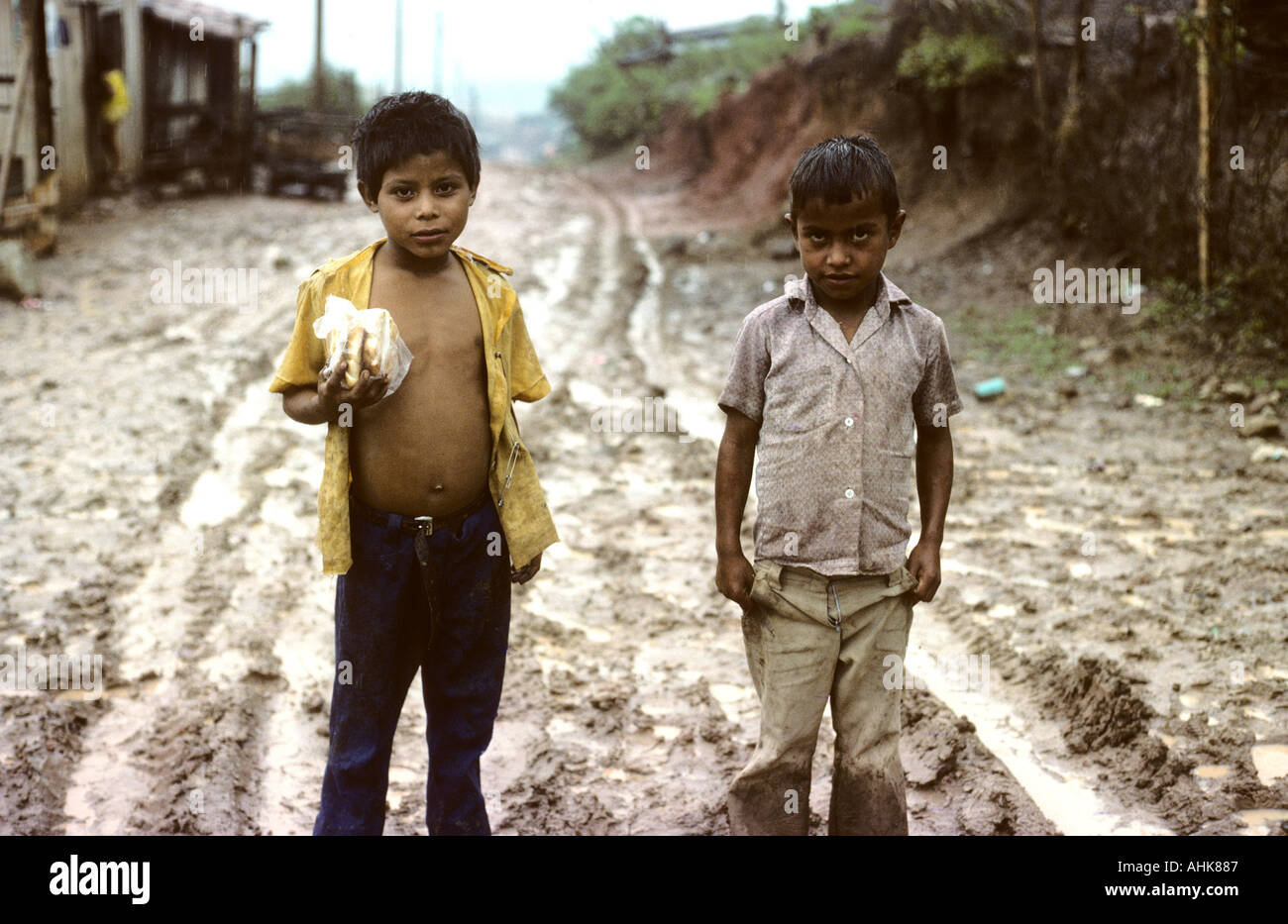 Honduras Two boys on a wet day in Tegucigalpa CENTRAL AMERICA Stock Photo