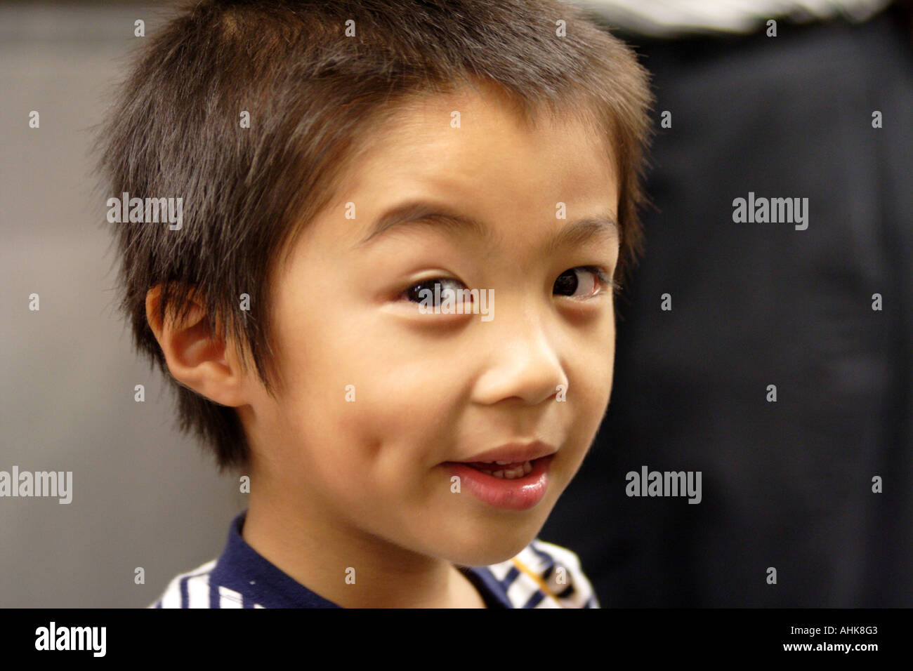 Cute Young Asian Boy Making Faces, Hong Kong Stock Photo