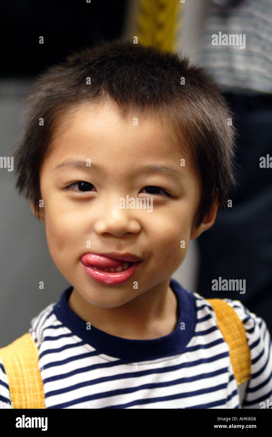 Cute Young Chinese Asian Boy Making Faces Stock Photo