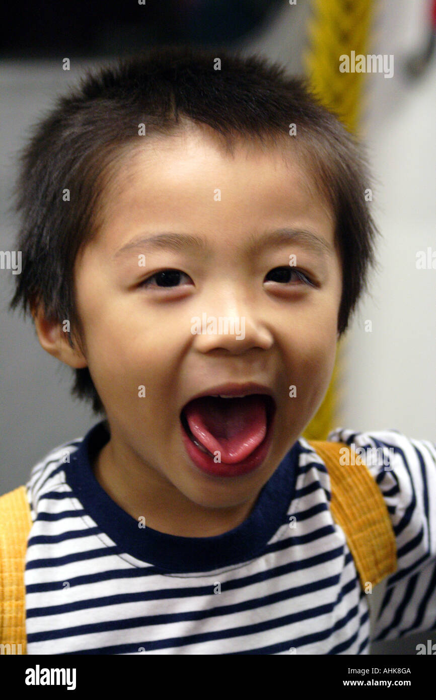 Cute Young Asian Boy Making Faces Stock Photo