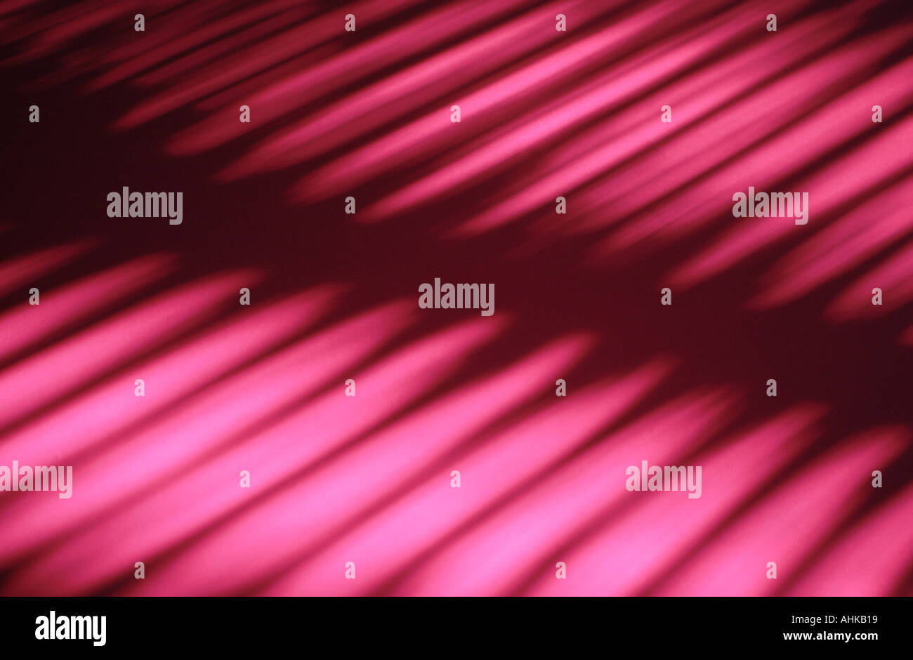 Shadows from louvered blinds Stock Photo