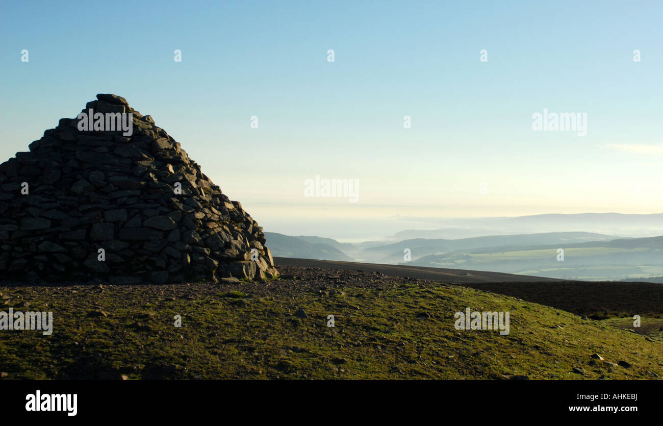 Sunrise over the beacon at the top of Dunkery Hill within the Exmoor National Park Stock Photo