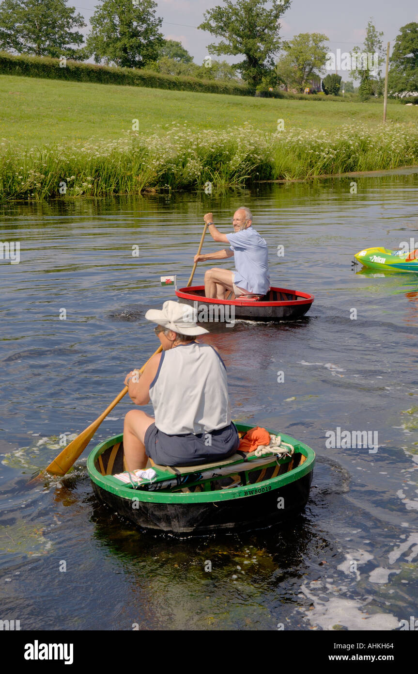 Coracles Approaching Finish at Burgedin Locks Annual Dinghy Dawdle Day Montgomery Canal Ardleen near Welshpool Mid Wales Stock Photo