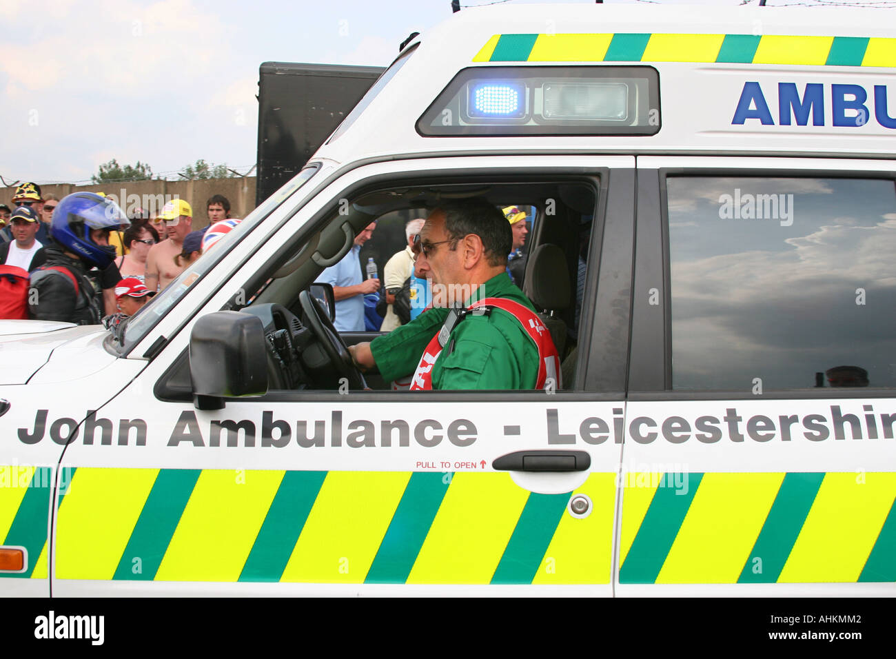 Saint Johns ambulance with driver and paramedic at a race meeting Stock
