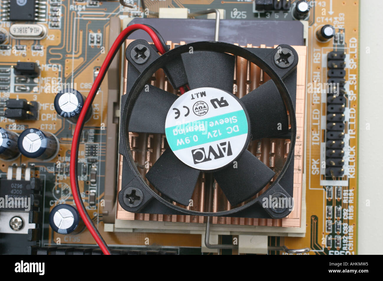 Fan and cooling fins in position on the top of a computer CPU Stock