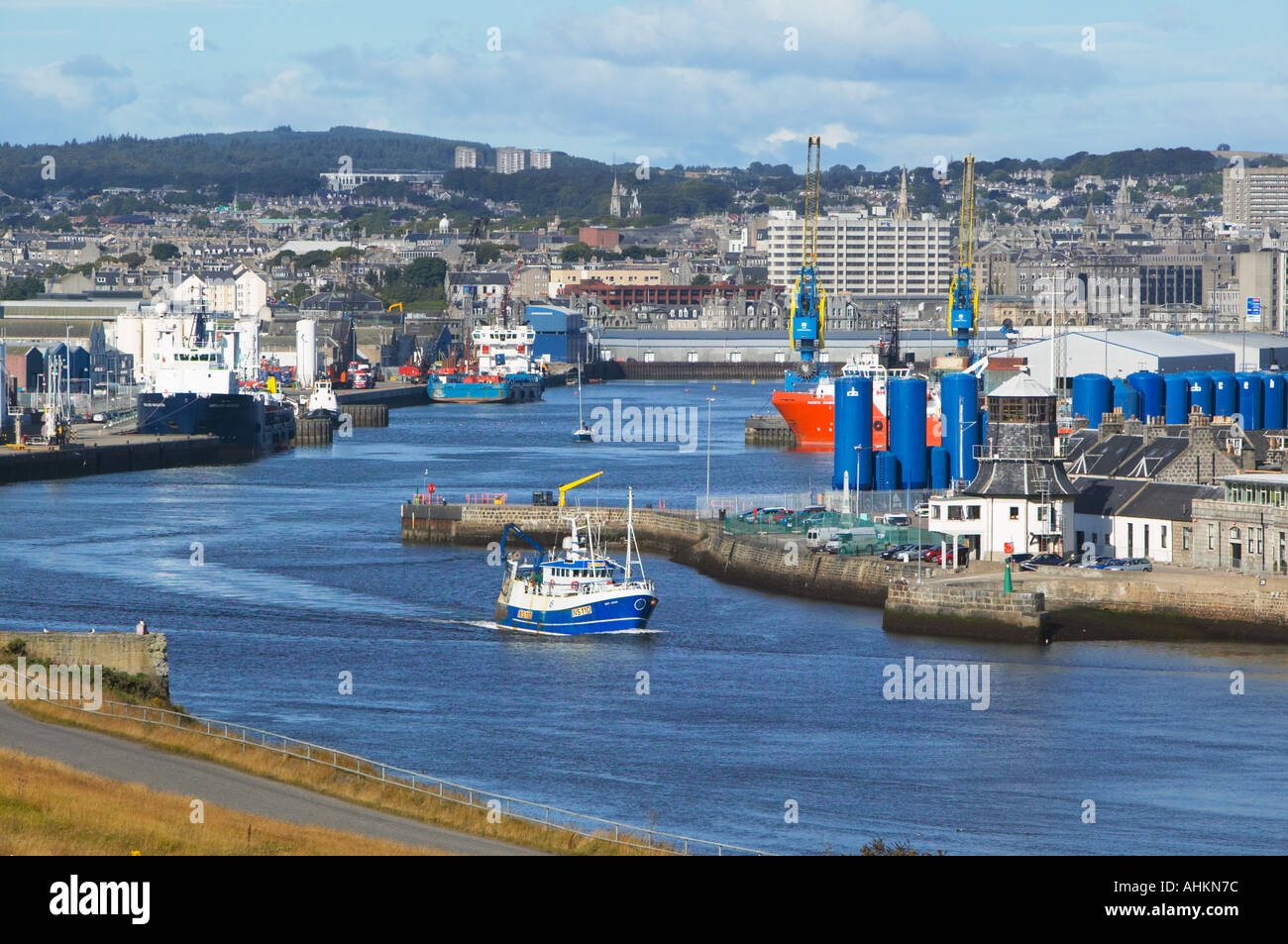 Aberdeen Harbour, Aberdeen, Scotland.  Small sishing boat leaving the harbour. Stock Photo