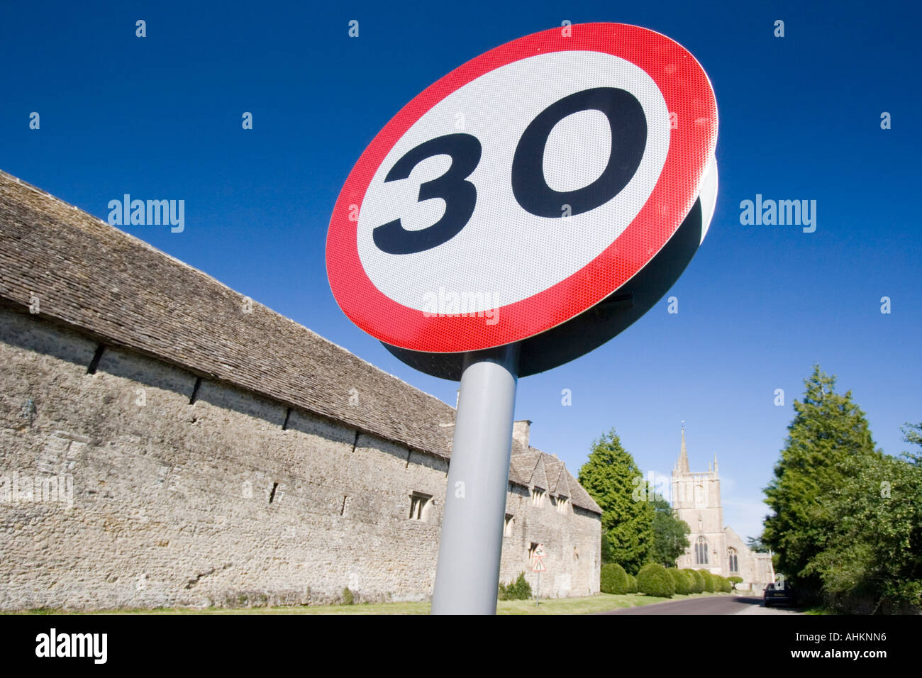 Speed limit sign 30mph on quiet country rural road Stock Photo