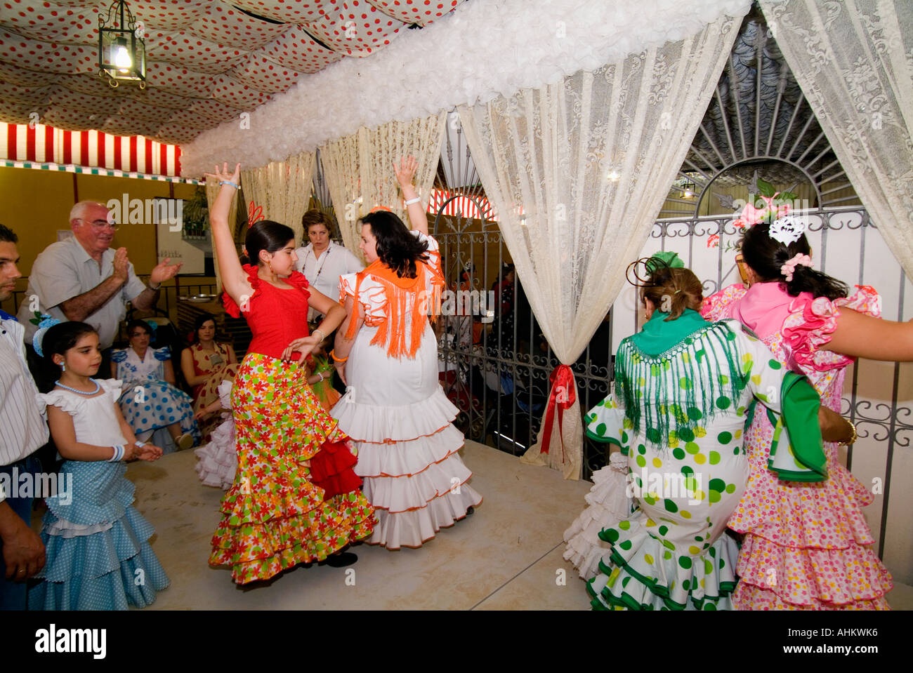 Annual feria de Sevilla, Seville Fair. Women dancing Sevillanas, the traditional dance on the Feria de Abril,  April Fair Stock Photo