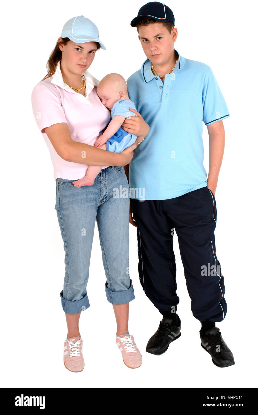 a couple of teenagers dressed as chavs with attitude holding their baby  Stock Photo - Alamy