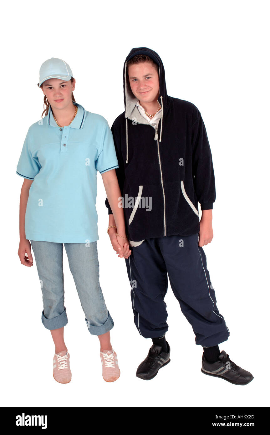 a couple of teenagers dressed as chavs in hooded tops with attitude Stock Photo