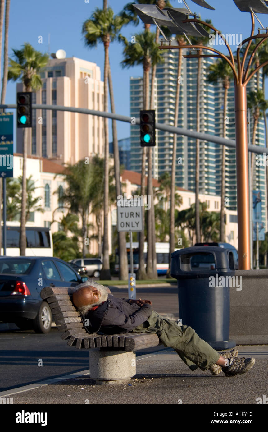 Homeless Person Sleeping On Bench Stock Photo Alamy