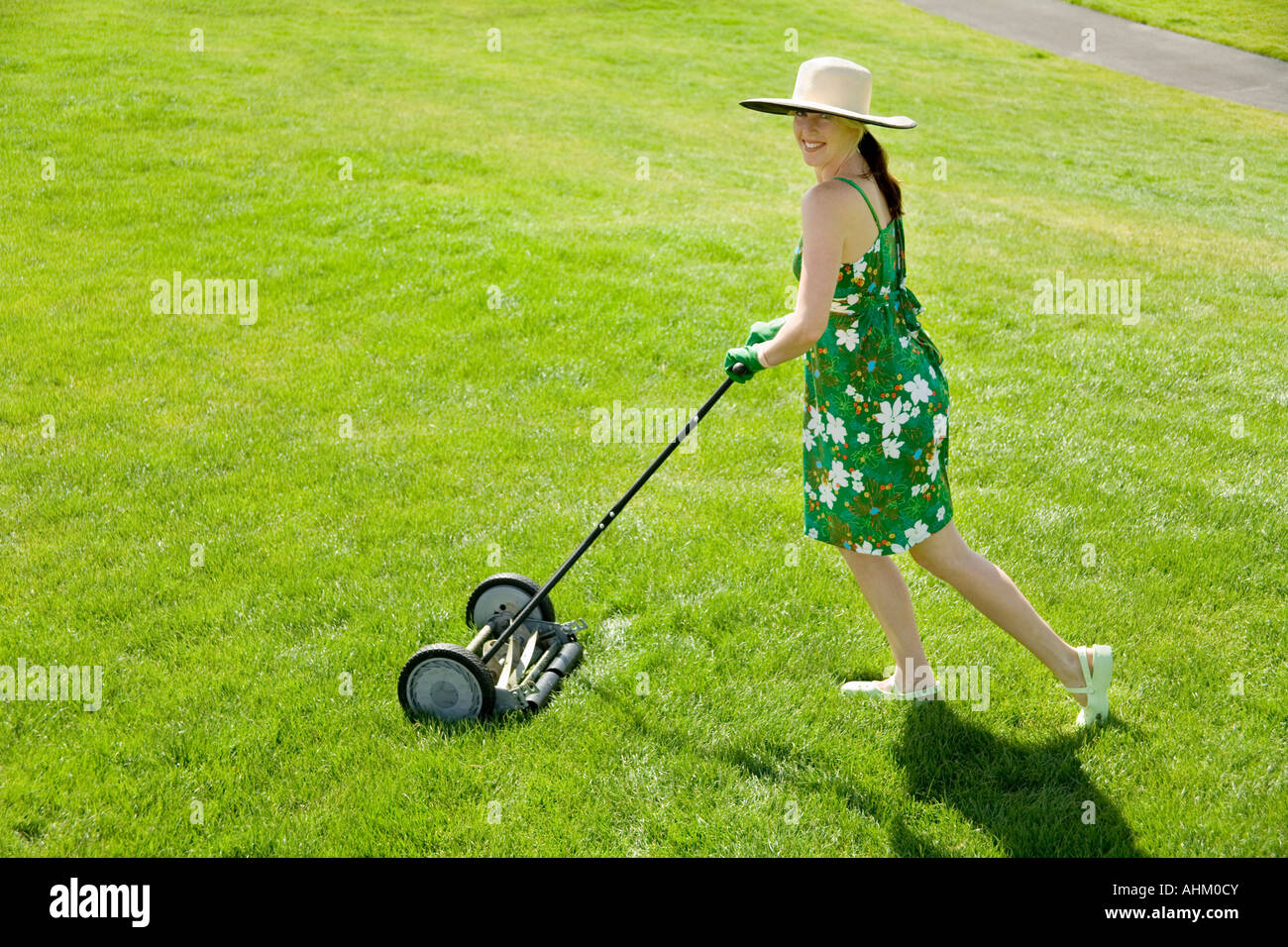 Woman Pushing Lawn Mower High Resolution Stock Photography And Images