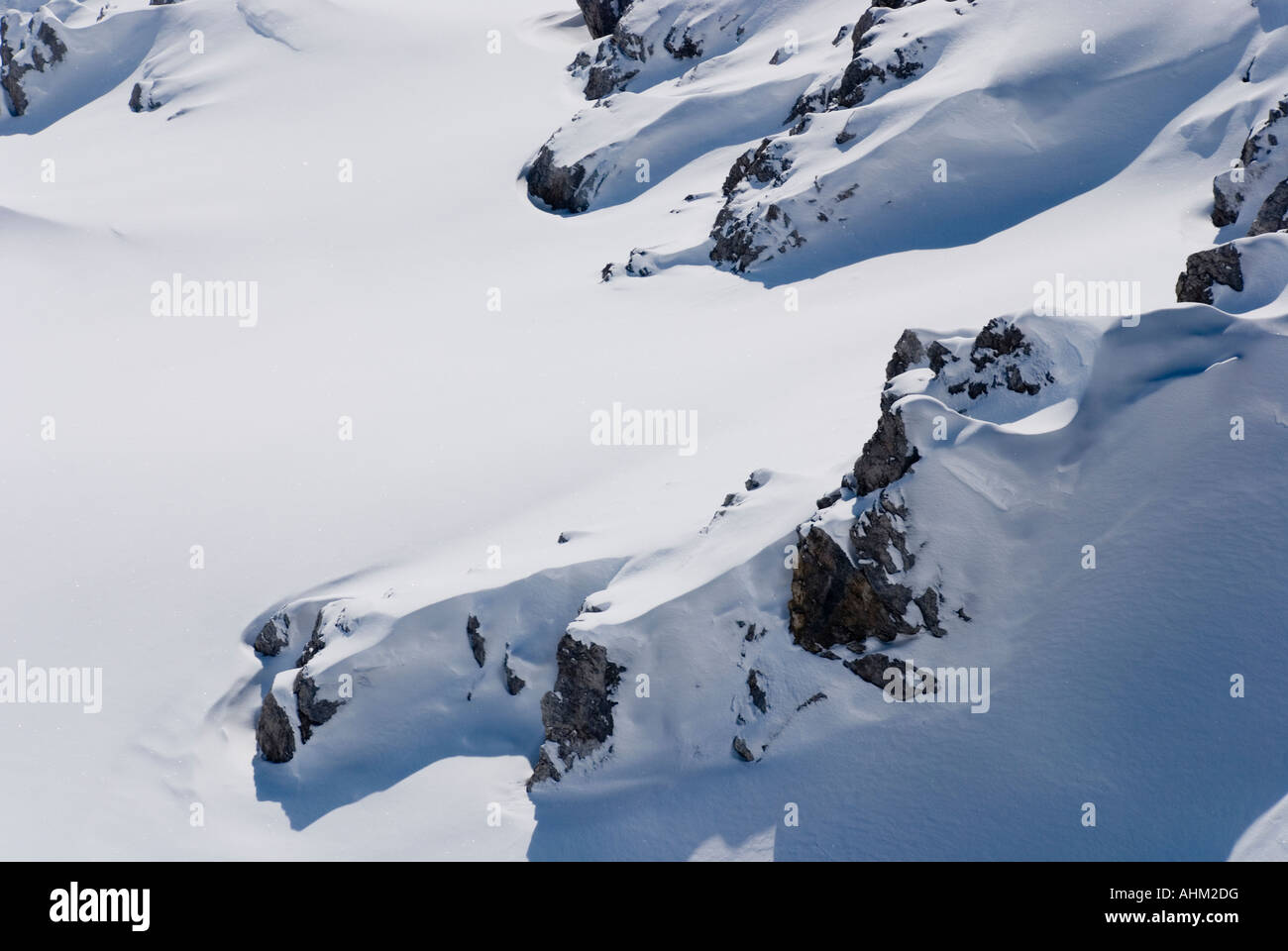 Snow drifts on a ridge in the Alps Stock Photo - Alamy