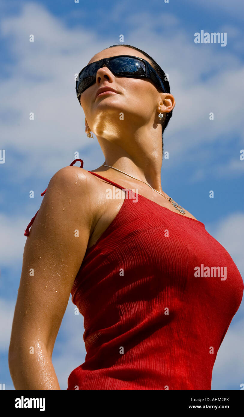 Powerful shot of a dripping wet dark haired statuesque beautiful young woman Stock Photo