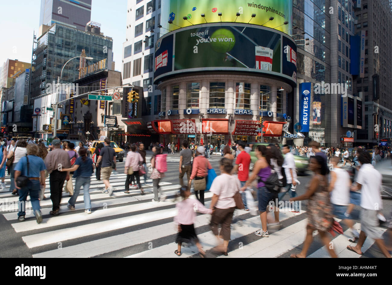 BLURRED CROWD CROSSING FORTY SECOND STREET MIDTOWN MANHATTAN NEW YORK CITY USA Stock Photo